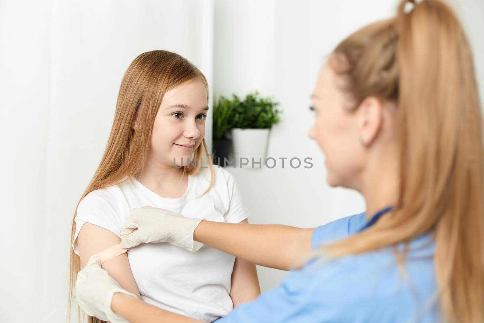 female doctor next to girl treatment health hospital by SHOTPRIME