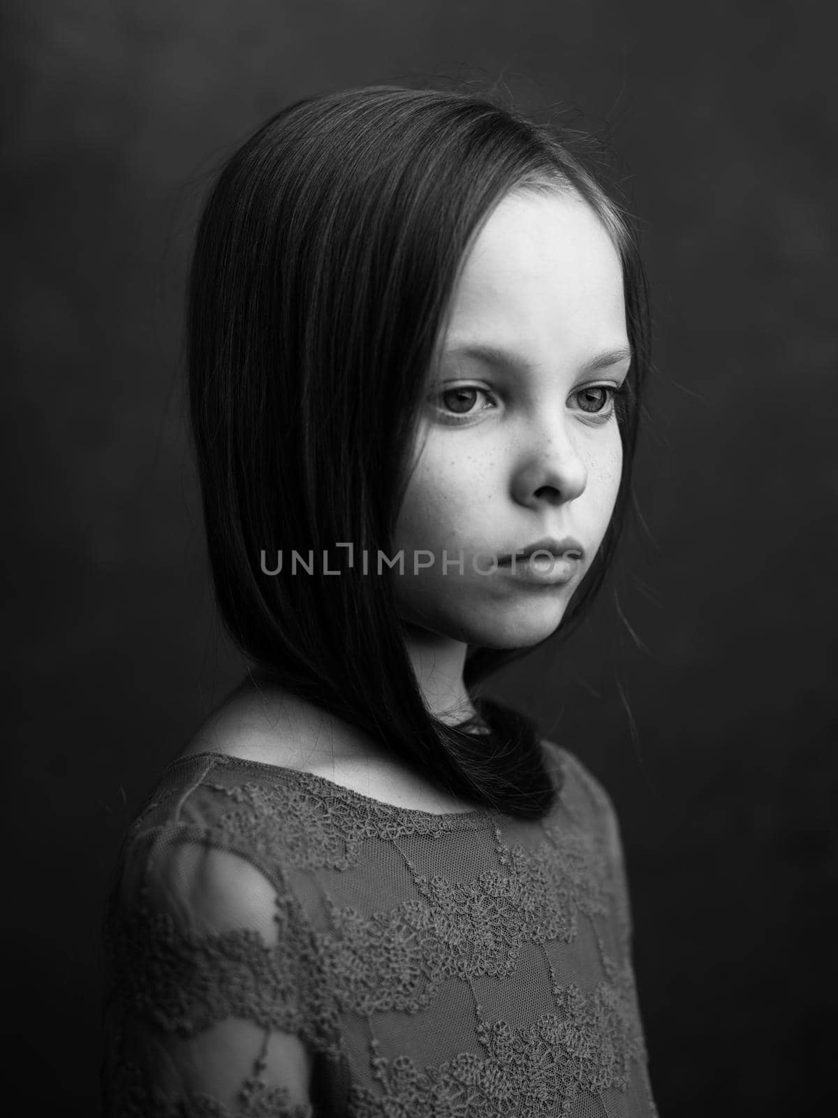 Beautiful little girl portrait close-up cropped view in dark background model by SHOTPRIME