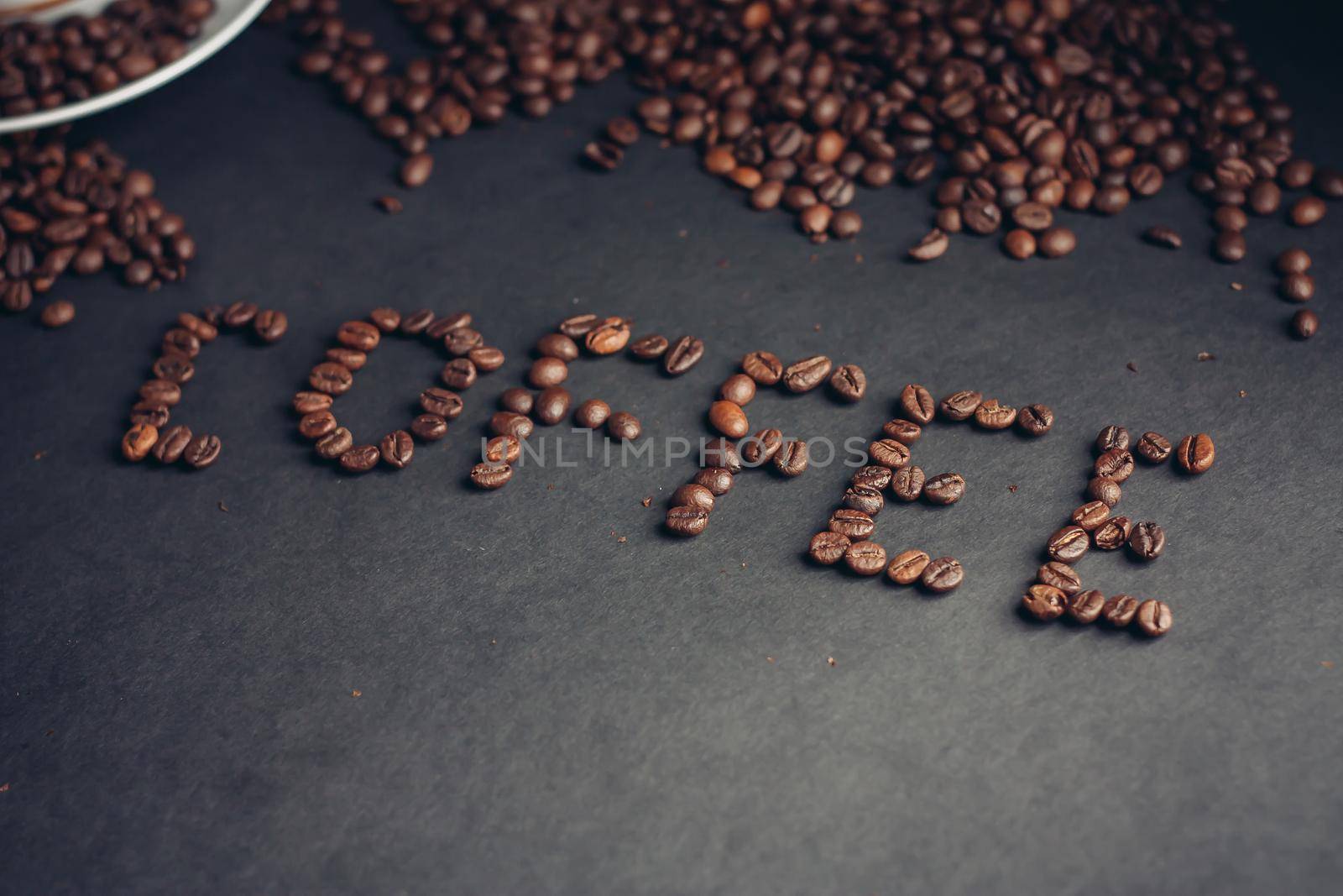 The word written from coffee beans drink aroma arabica cappuccino. High quality photo