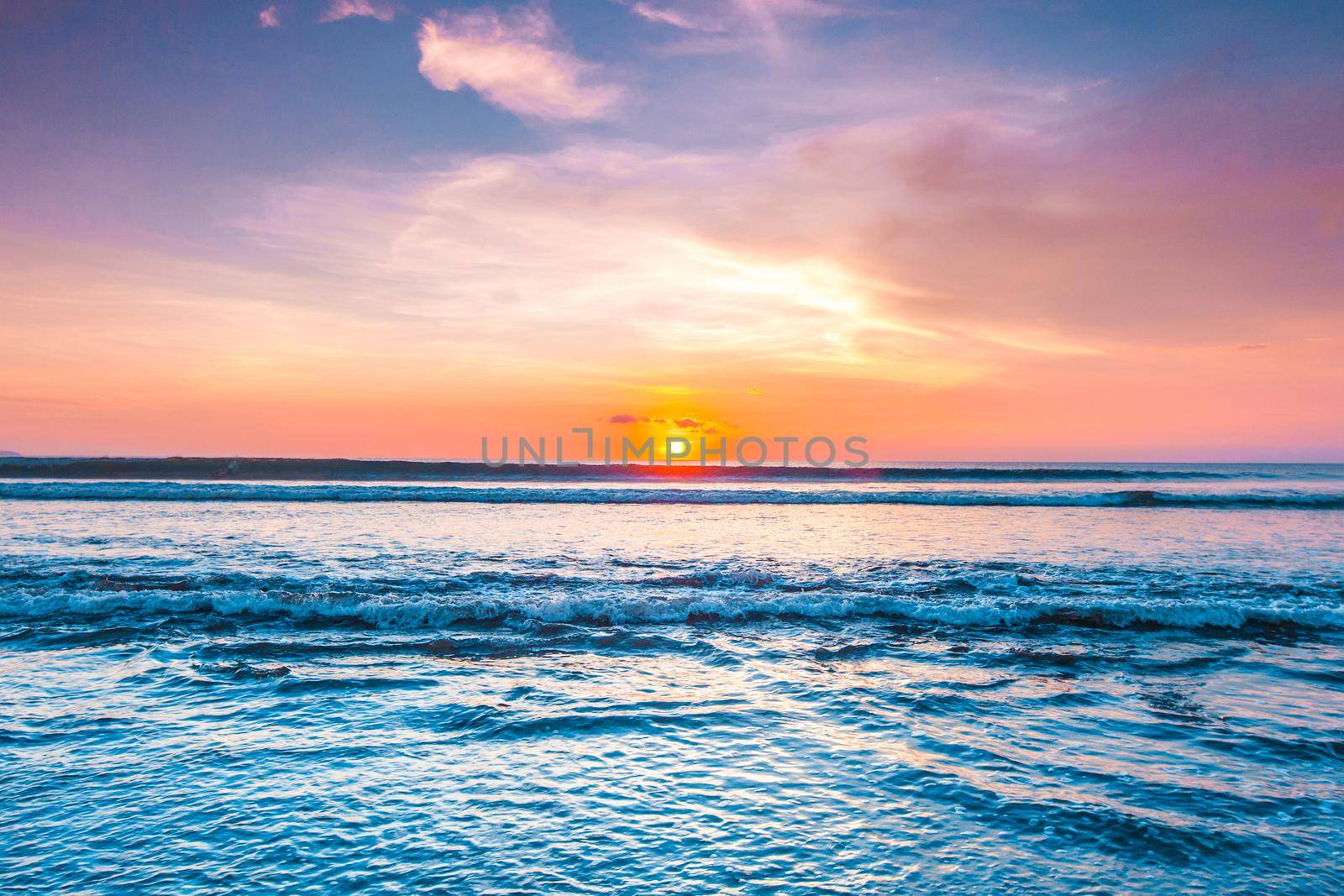 Amazing sunset from Bali Double Six beach surf waves and colorful clouds