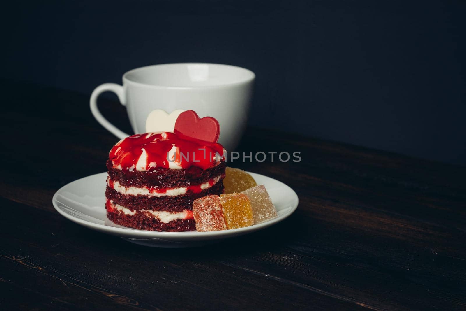cake on a saucer cup of tea sweets enjoyment snack. High quality photo