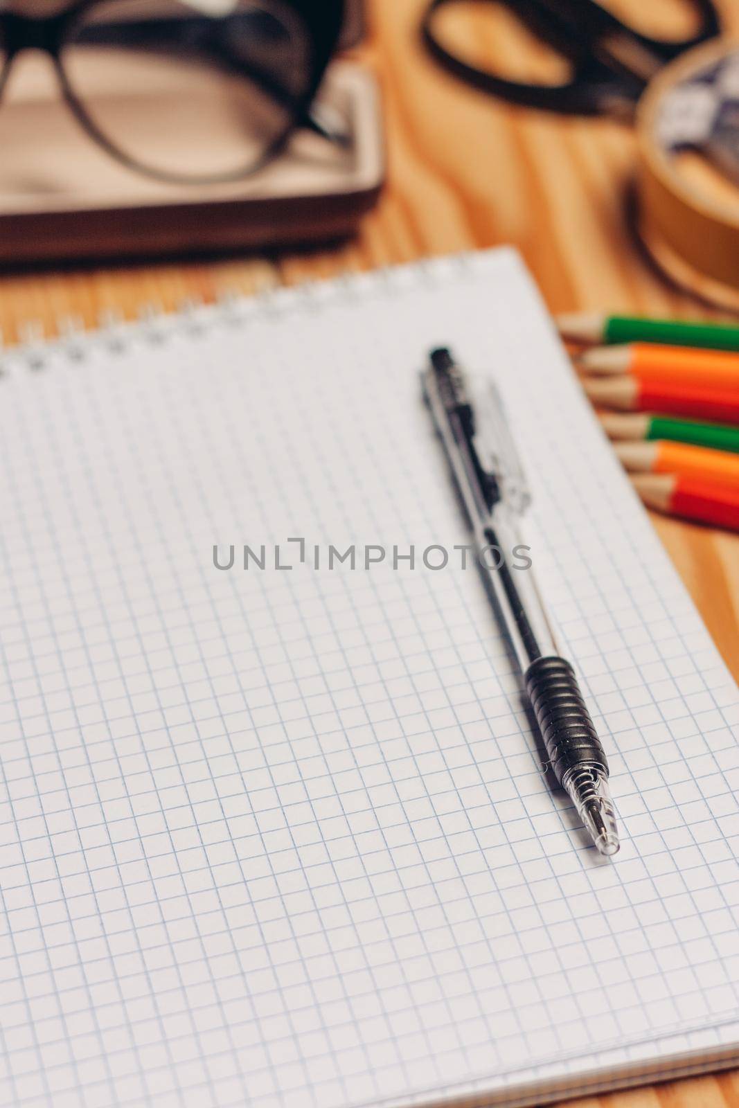 notepads felt-tip pens stationery glasses in a case work desk by SHOTPRIME