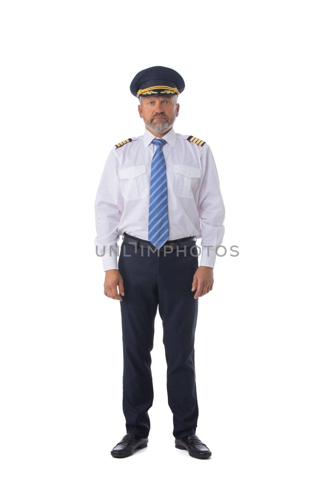 Airline pilot wearing the four bar Captains epaulettes, first pilot, aircraft commander, isolated on white background, full length portrait