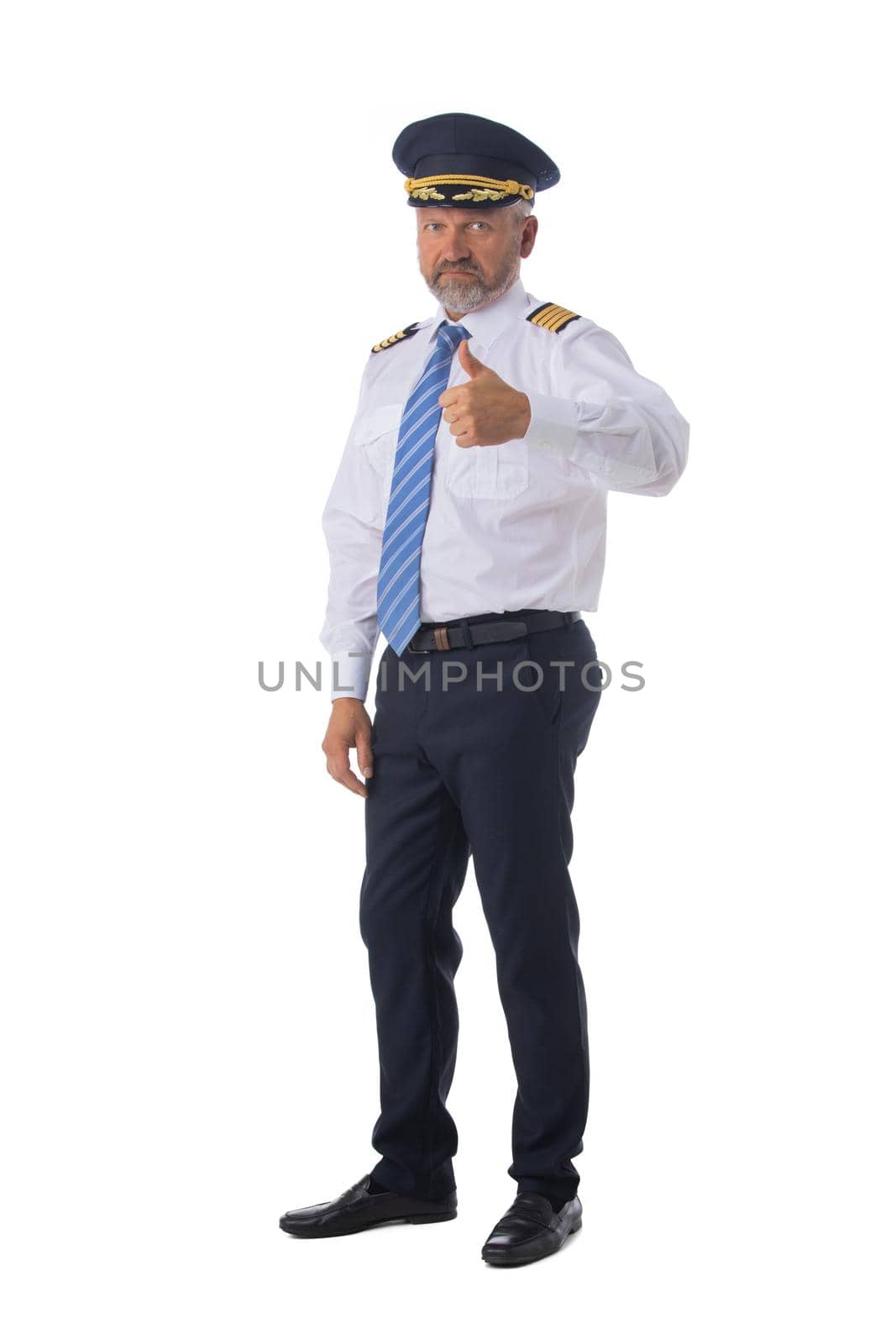 Airline pilot, aircraft commander with thumb up isolated on white background full length studio portrait