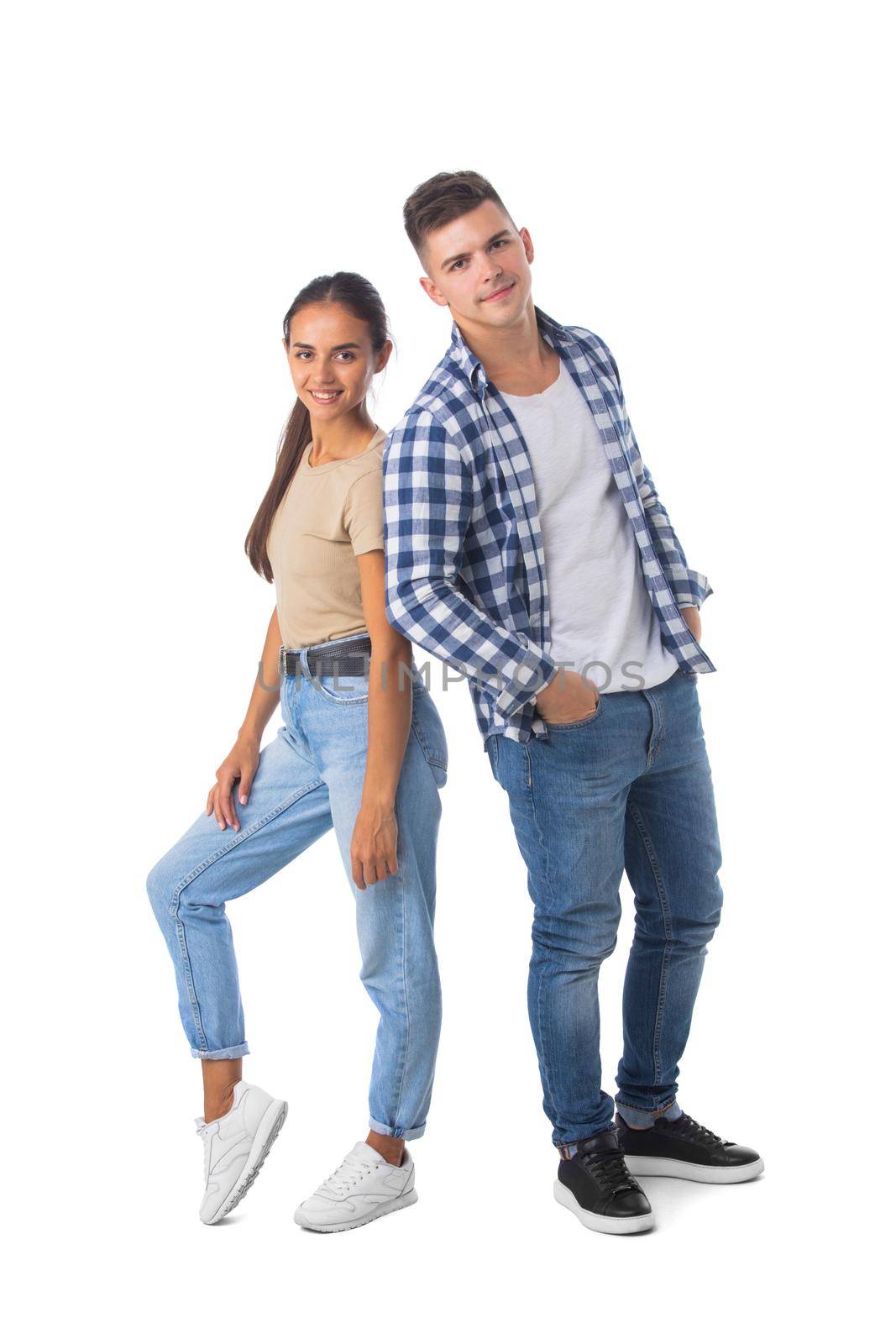 Smiling young couple standing together full length portrait isolated on white background