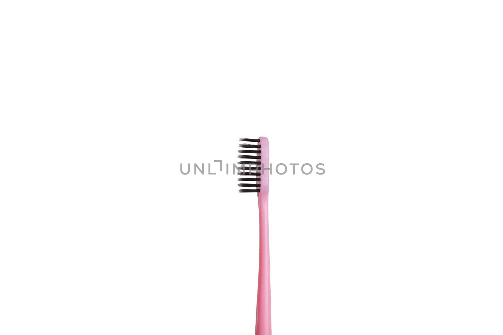 The pink tooth brushing cheek is isolated on a white background. Care and hygiene for the oral cavity