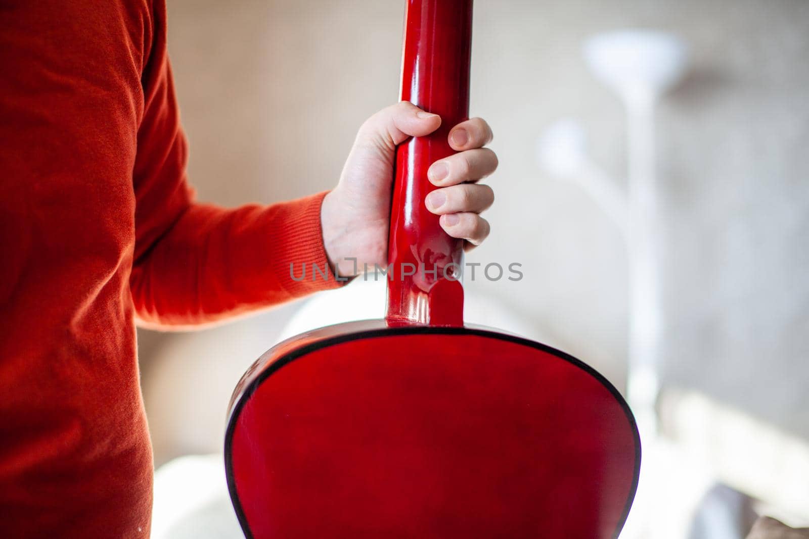 Close-up of a guitar player or a person learning to play the guitar. by AnatoliiFoto