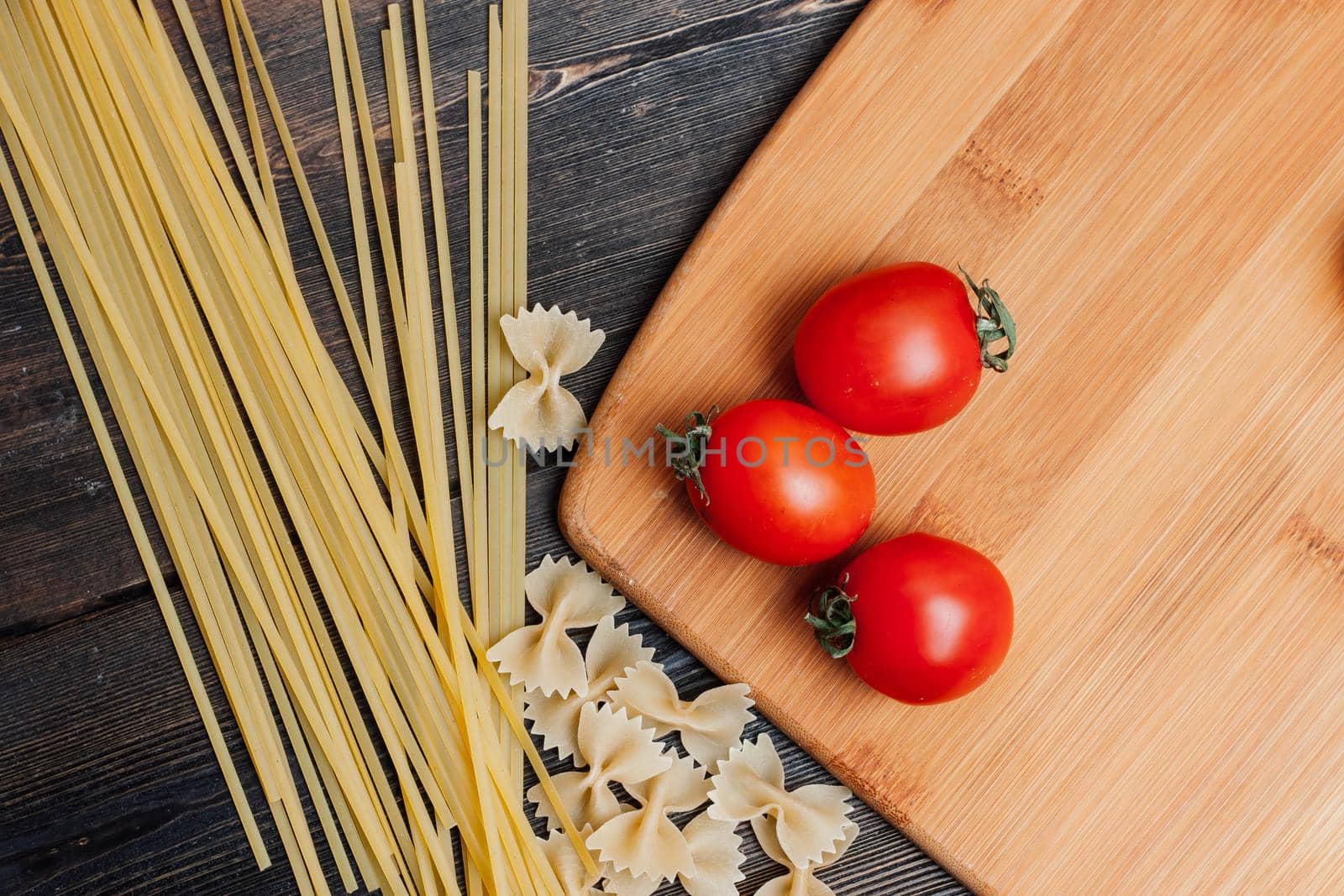 Italian pasta ingredients cooking kitchen wooden table. High quality photo