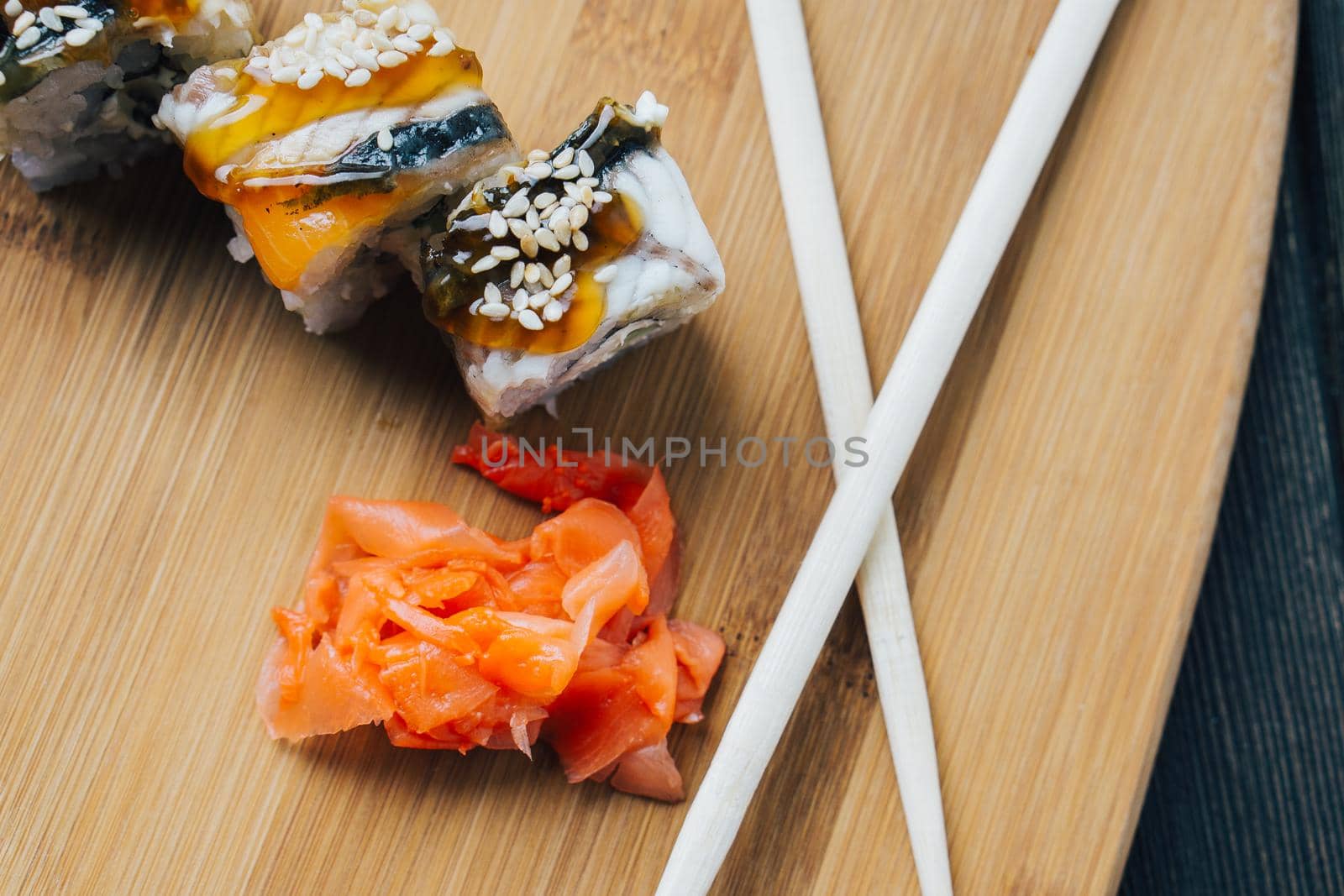 sushi chopsticks wood board japanese cuisine restaurant. High quality photo