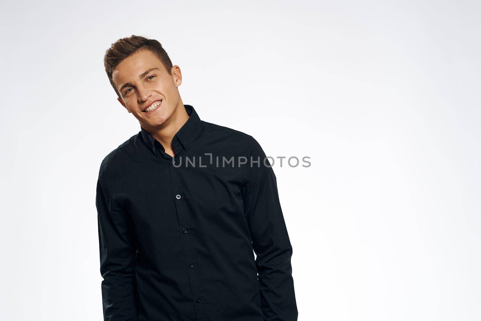business man in black shirt studio cropped view gray background. High quality photo