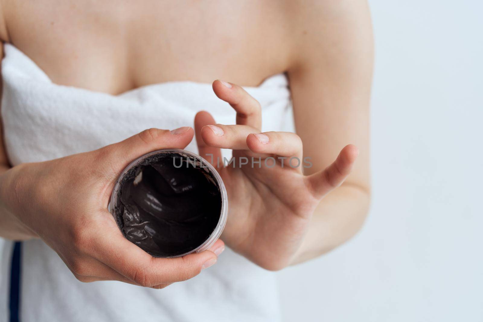 Woman towel shower skin care black cream spa treatments. High quality photo