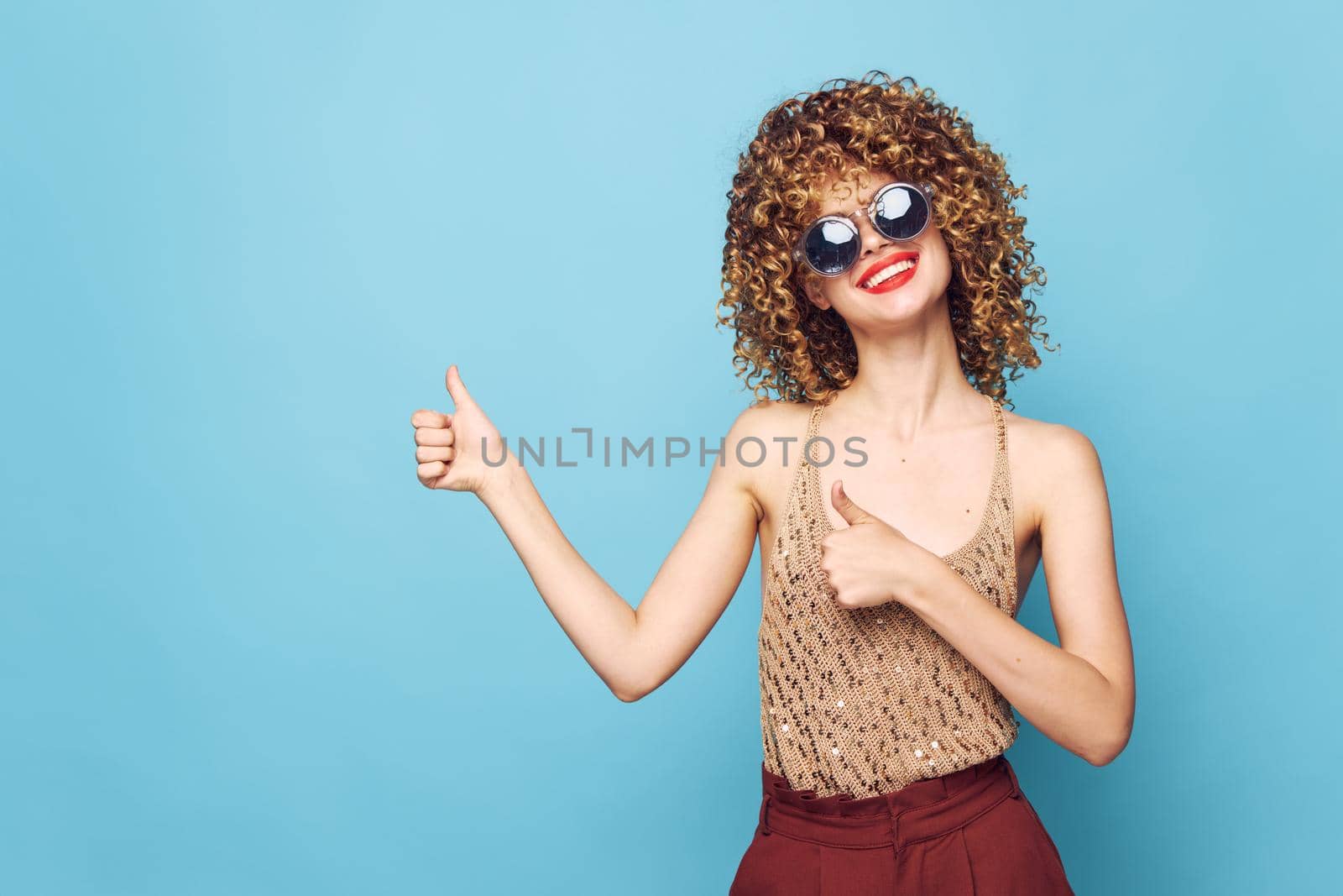 Pretty woman Curly hair smile dark glasses positive gesture with hands Copy Space by SHOTPRIME