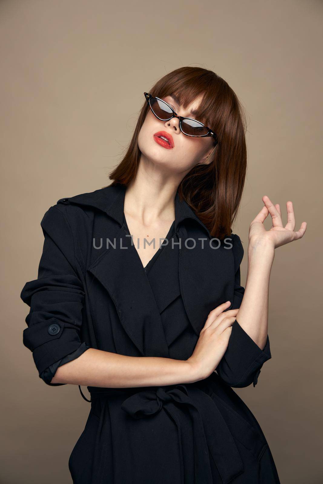 Charming brunette leaned over to the side dark glasses studio