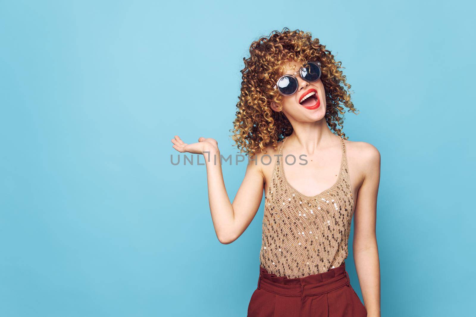 Sexy model Red lips curly hair Copy Space hand gesture bright makeup isolated background