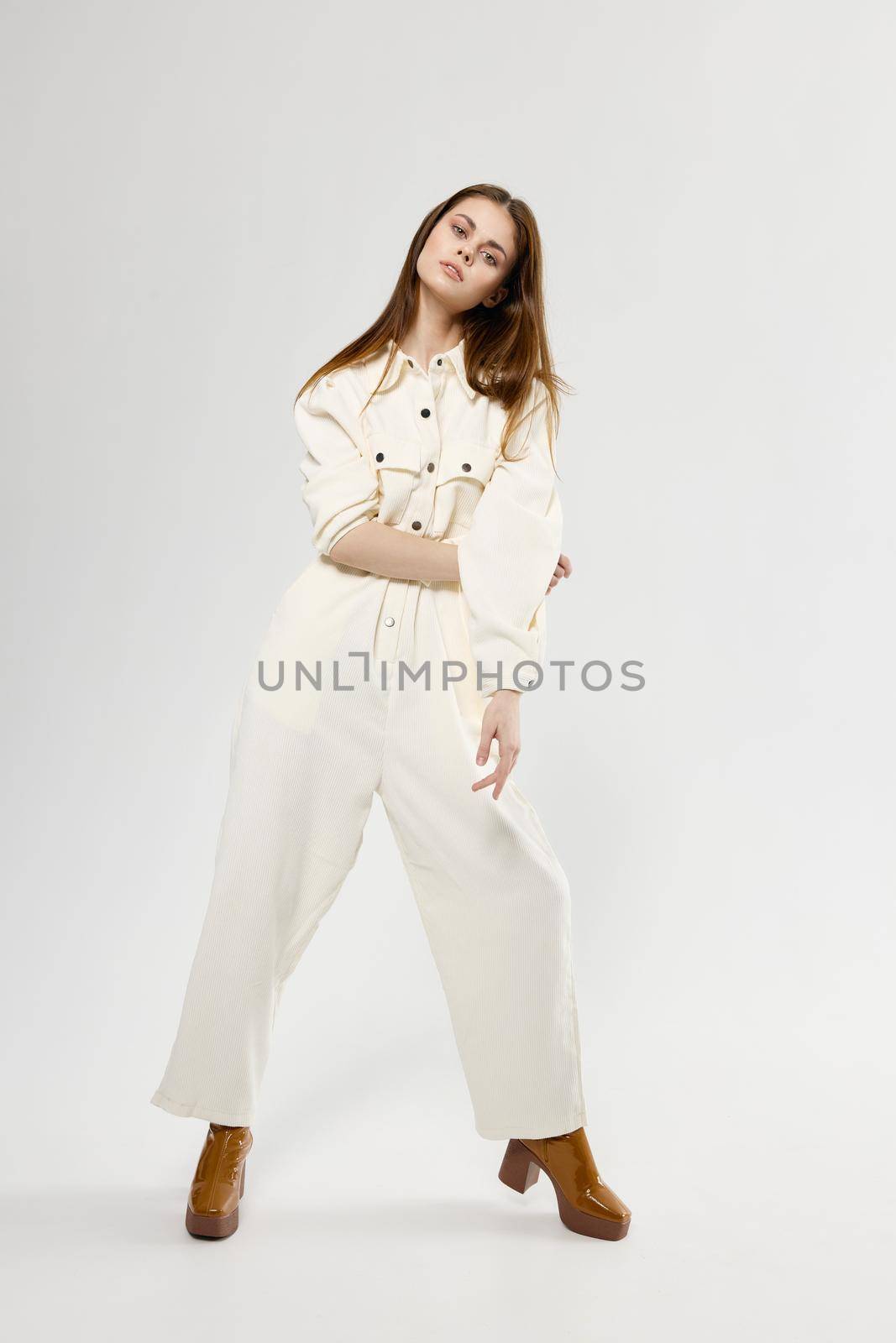 pretty woman in white jumpsuit studio fashion lifestyle model by SHOTPRIME