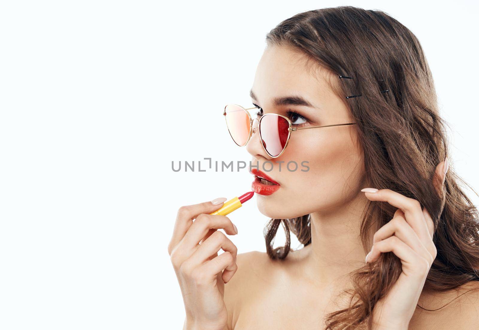Woman in sunglasses with red lipstick cropped view. High quality photo