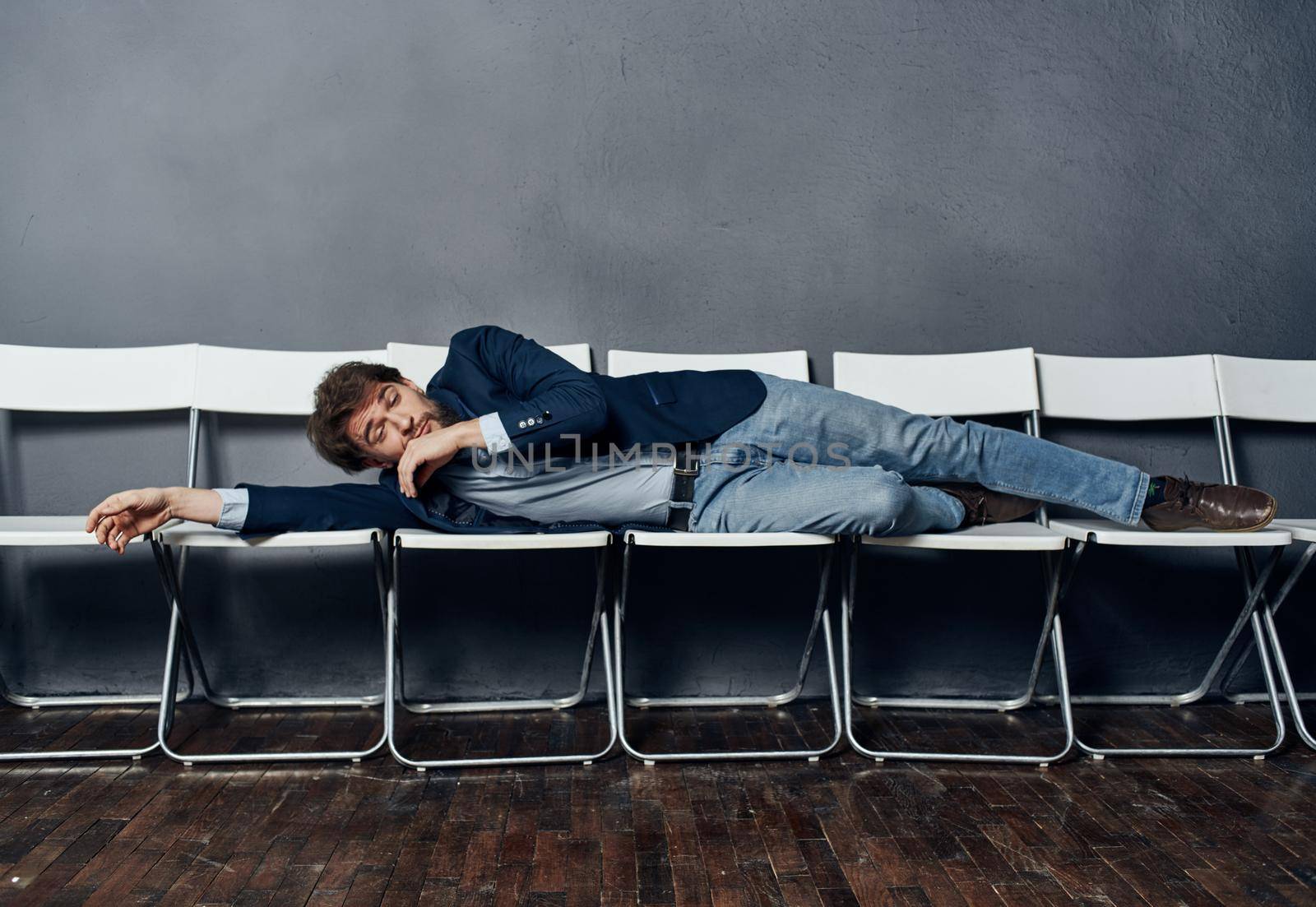 Man in suit on chairs work office career lifestyle. High quality photo