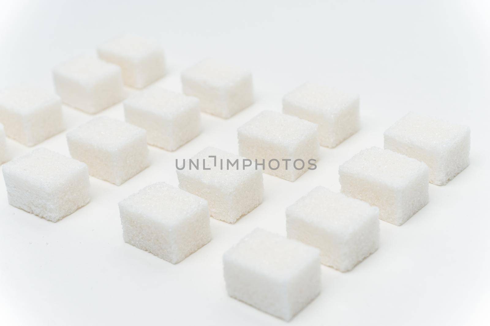 sugar cubes glucose ingredient calories energy light background. High quality photo