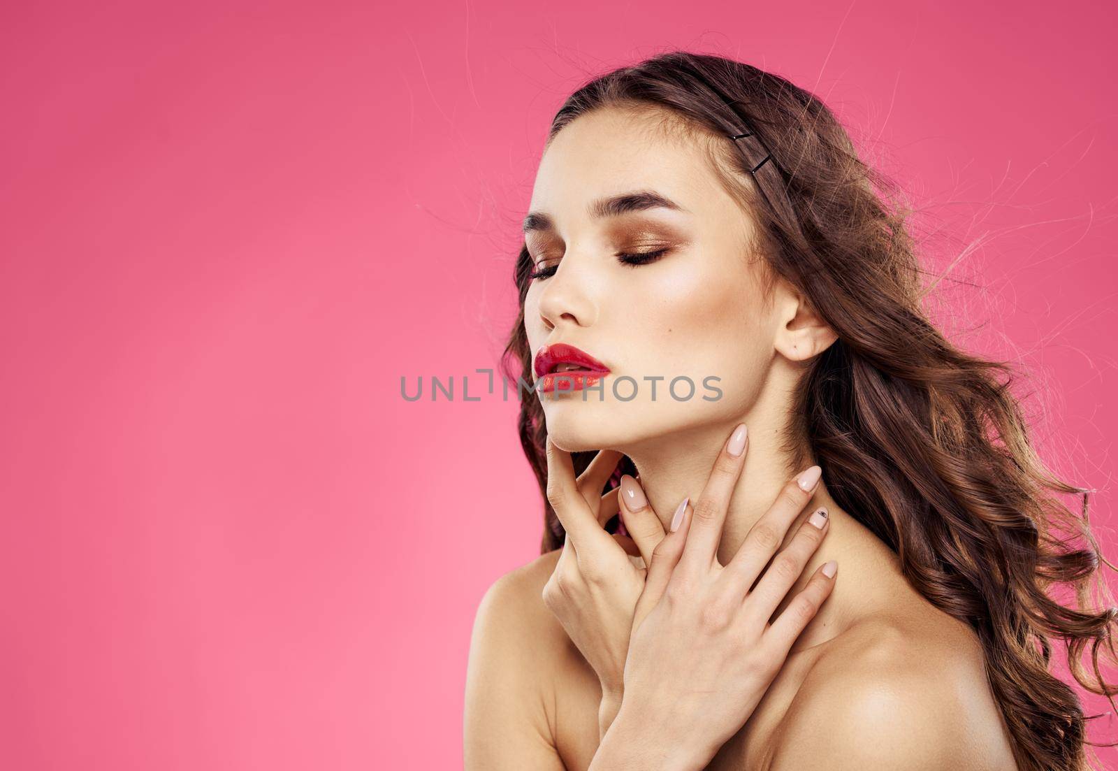 Woman with closed eyes on a pink background evening makeup red lips by SHOTPRIME