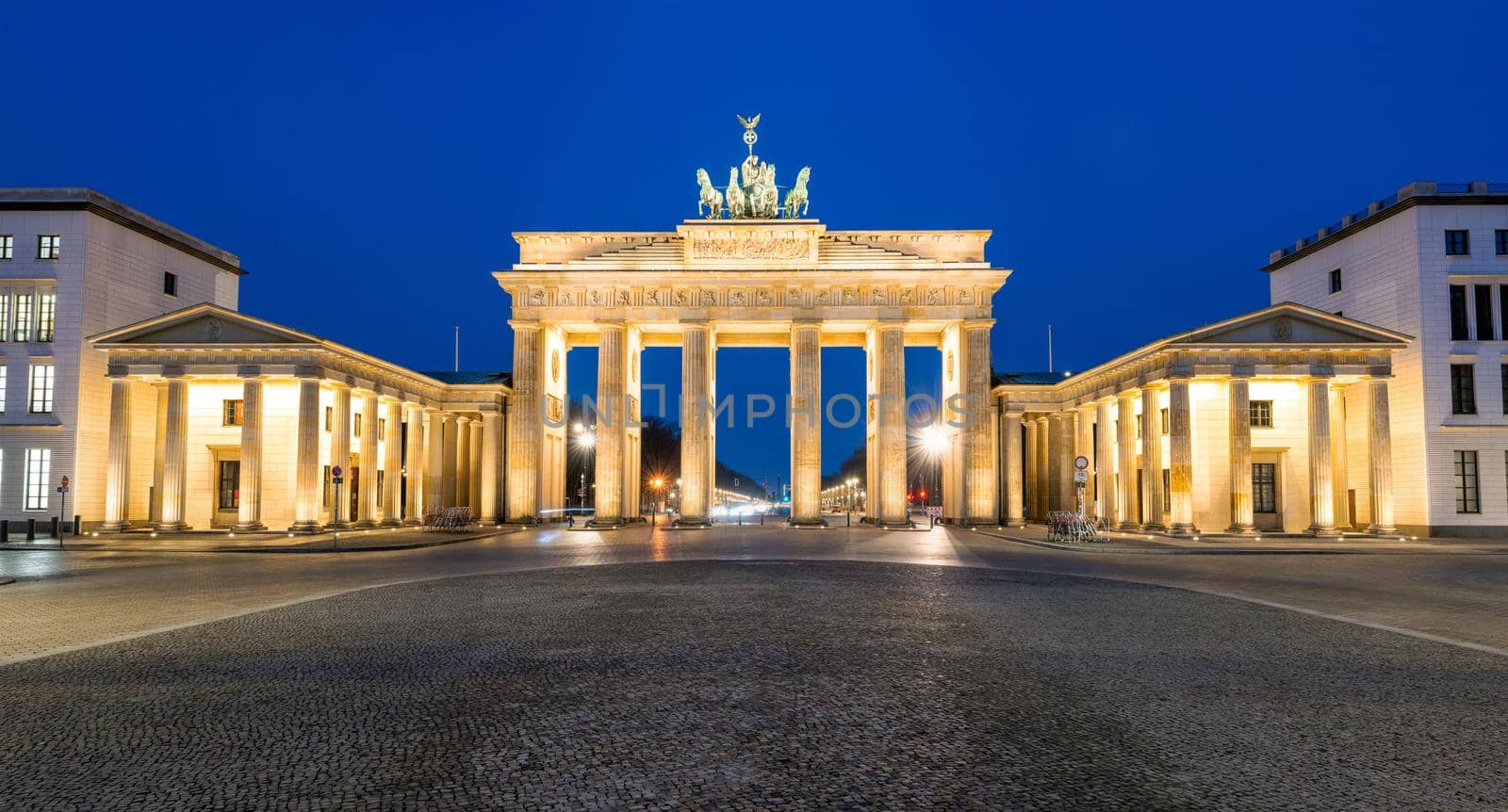 Panorama of the illuminated Brandenburg Gate in Berlin at night