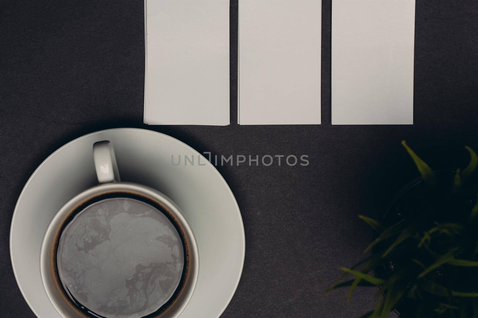 business cards on table and coffee cup pen top view. High quality photo