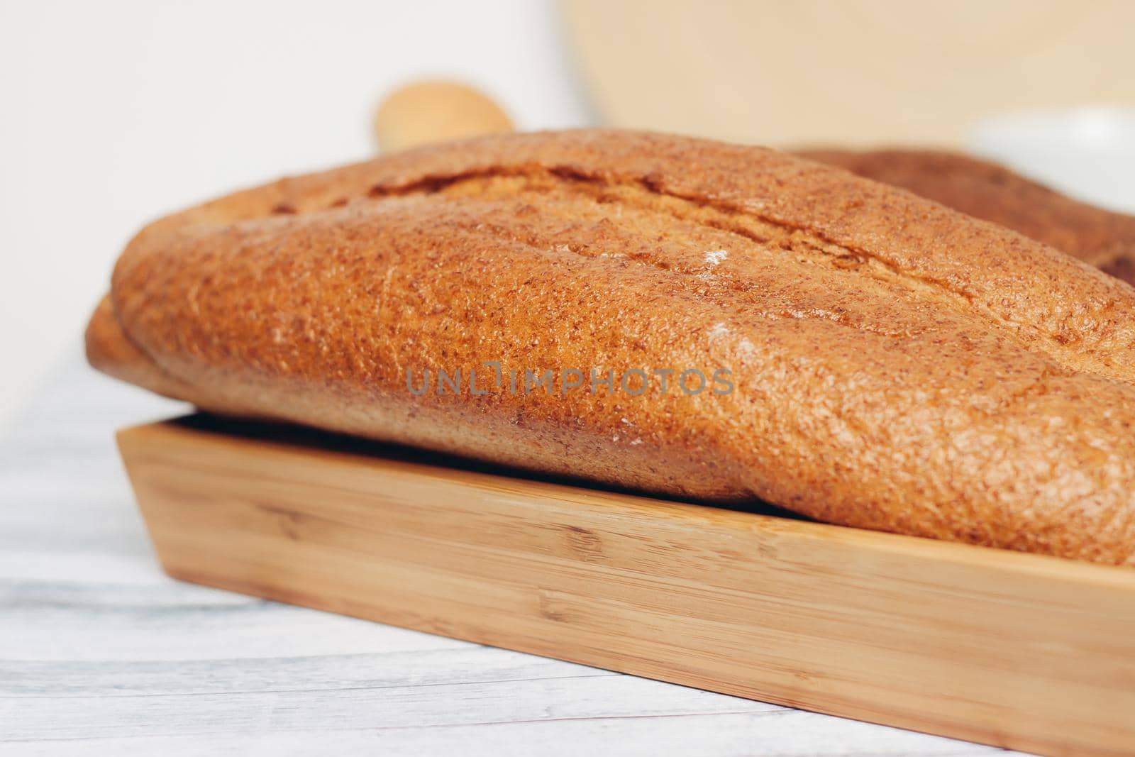 fresh loaf bread bins on the table kitchen food ration . High quality photo