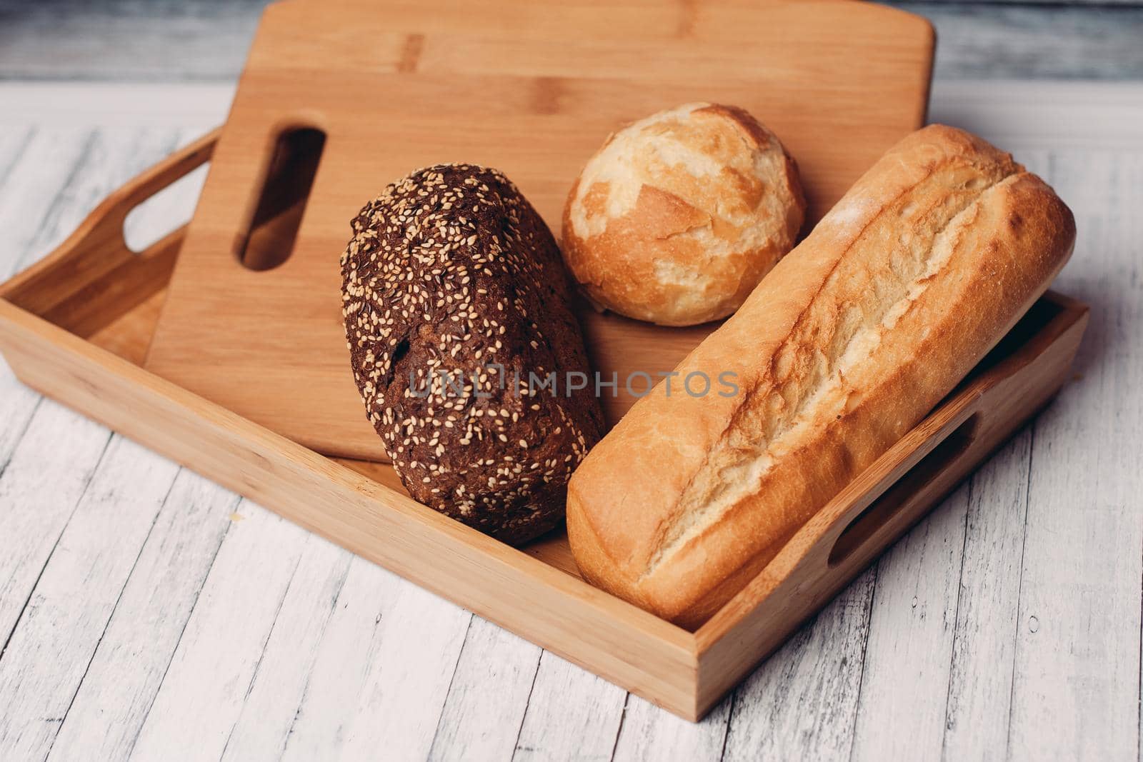 whole grain bread loaves homemade cakes cooking wood board close-up. High quality photo