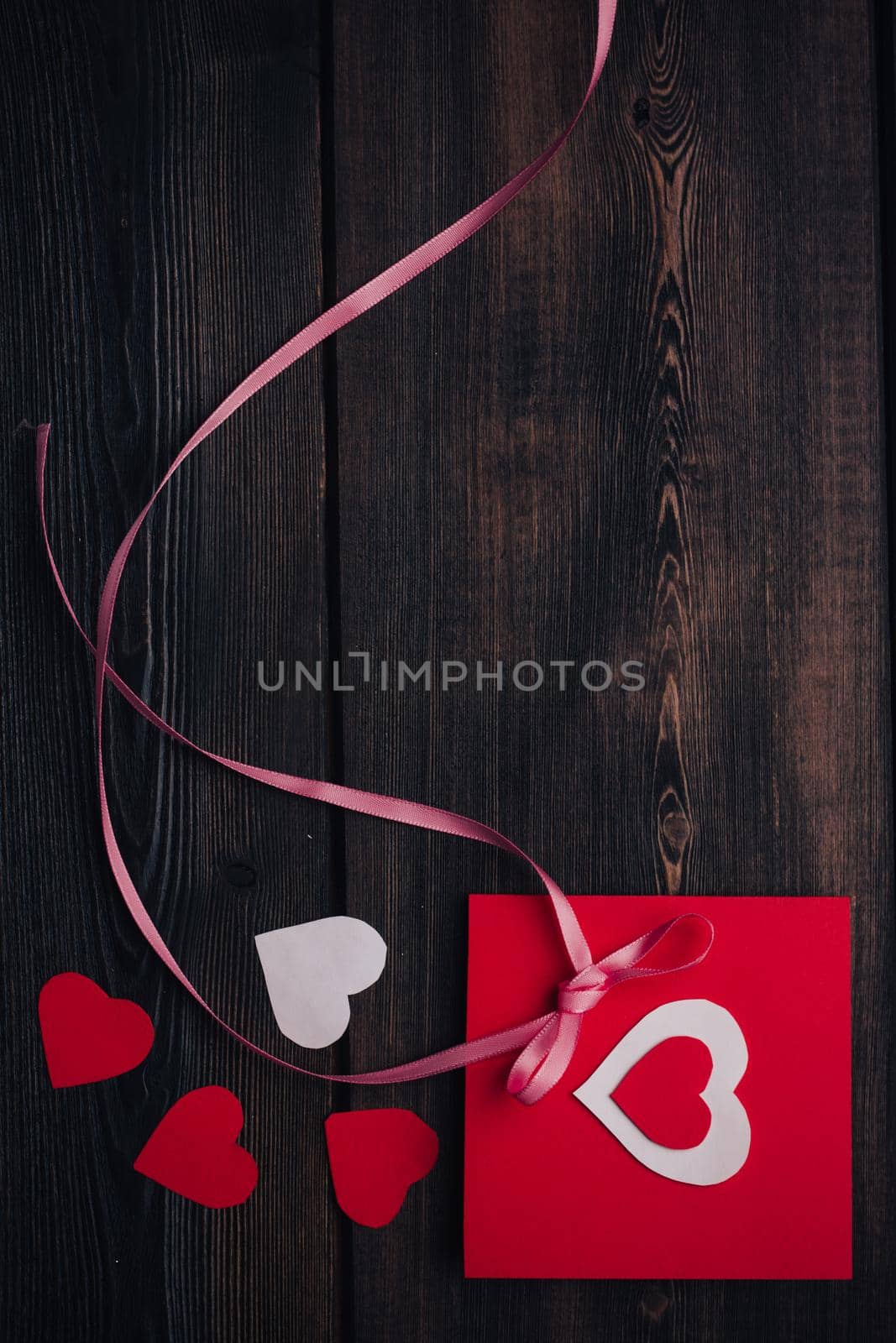 greeting card with heart holiday gift valentines day decoration wooden background. High quality photo