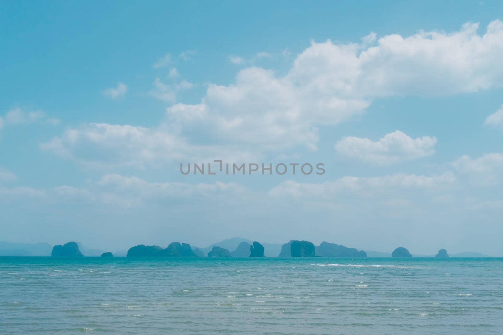 Tropical nature clean beach and white sand in summer with sun light blue sky background. by Suwant