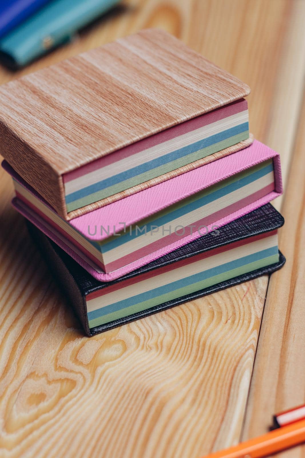 colorful notepads office wooden table paper work is education by SHOTPRIME