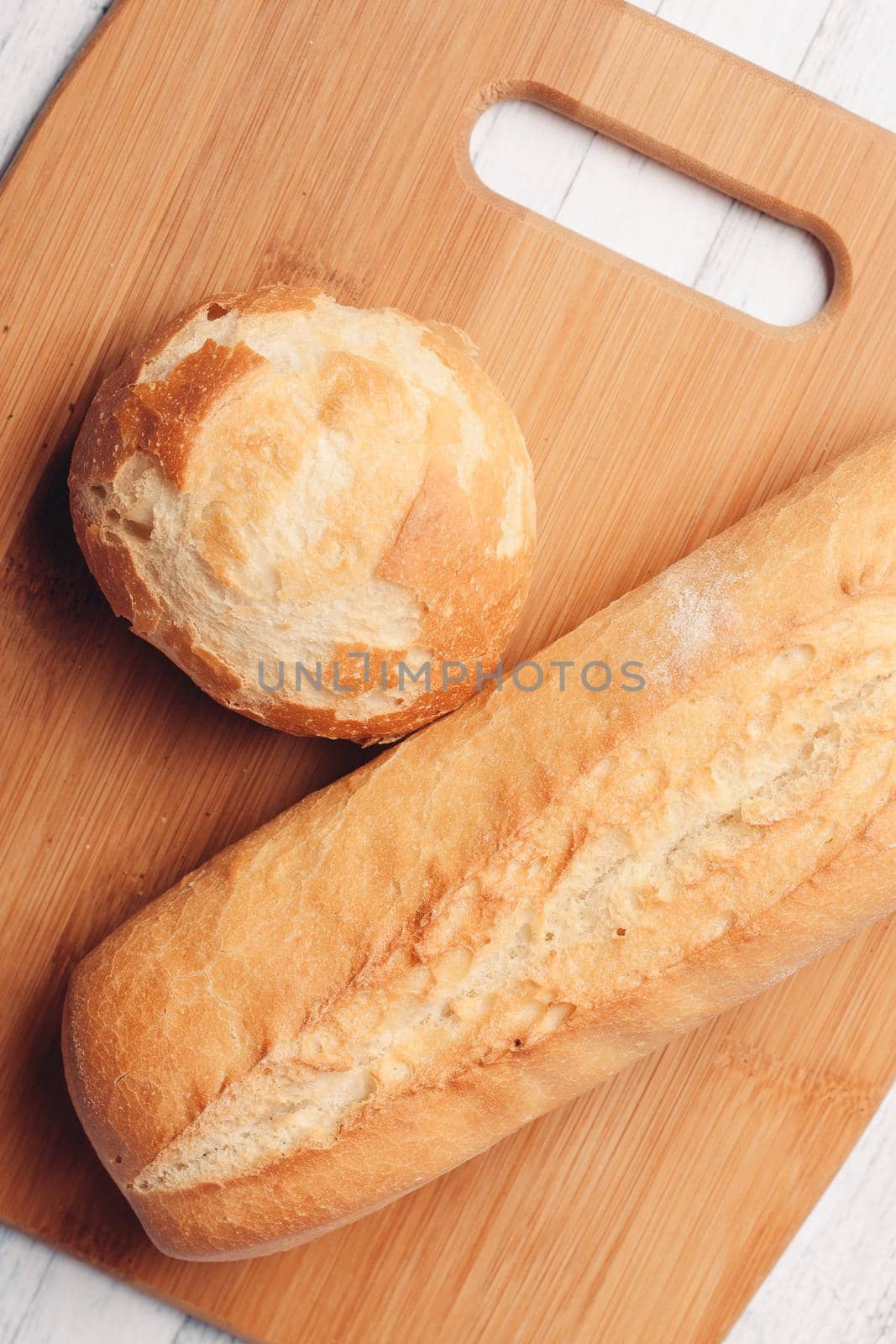 rye loaf on a wooden board top view soft bun by SHOTPRIME