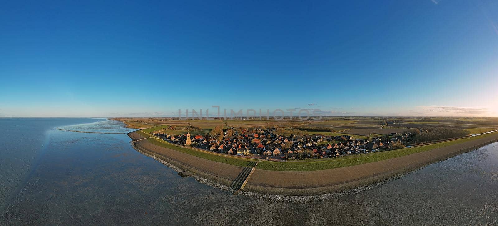 Panoramic aerial from the little village Wierum at the Wadden Sea in the Netherlands by devy