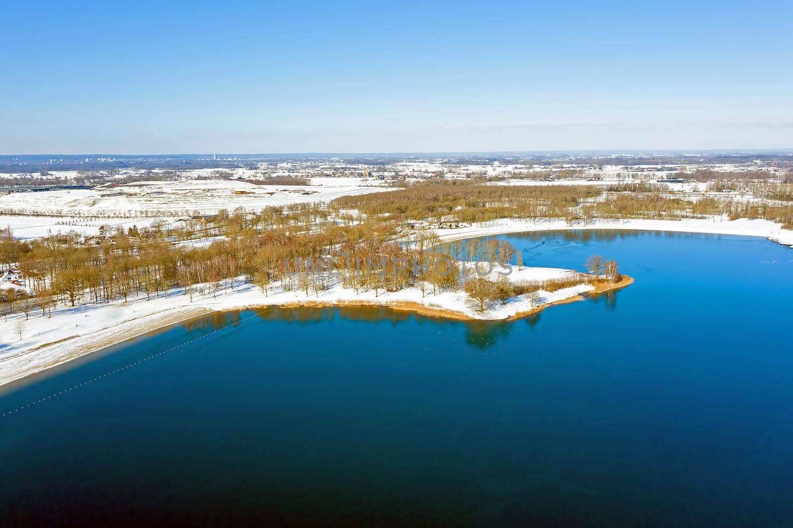 Aerial from lake Bussloo in the Netherlands in winter by devy