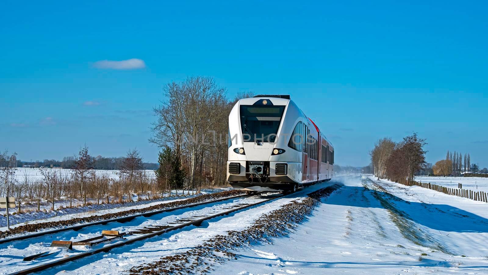 Train driving in the countryside from the Netherlands on a winter day