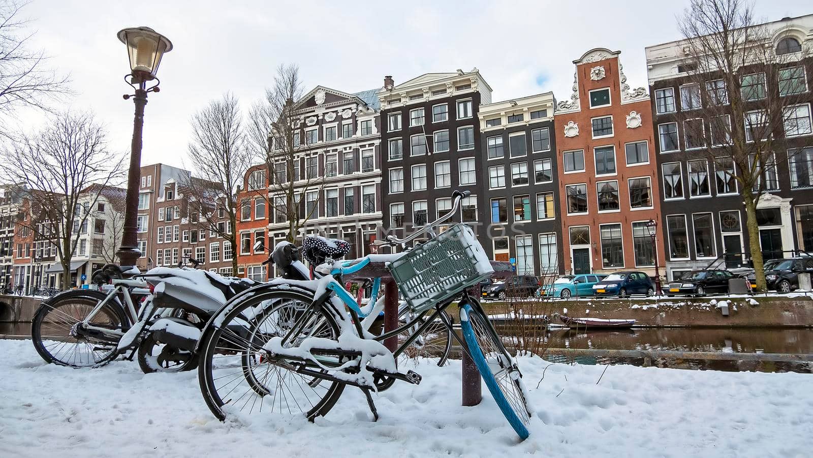 Snowy city Amsterdam in the Netherlands in winter by devy