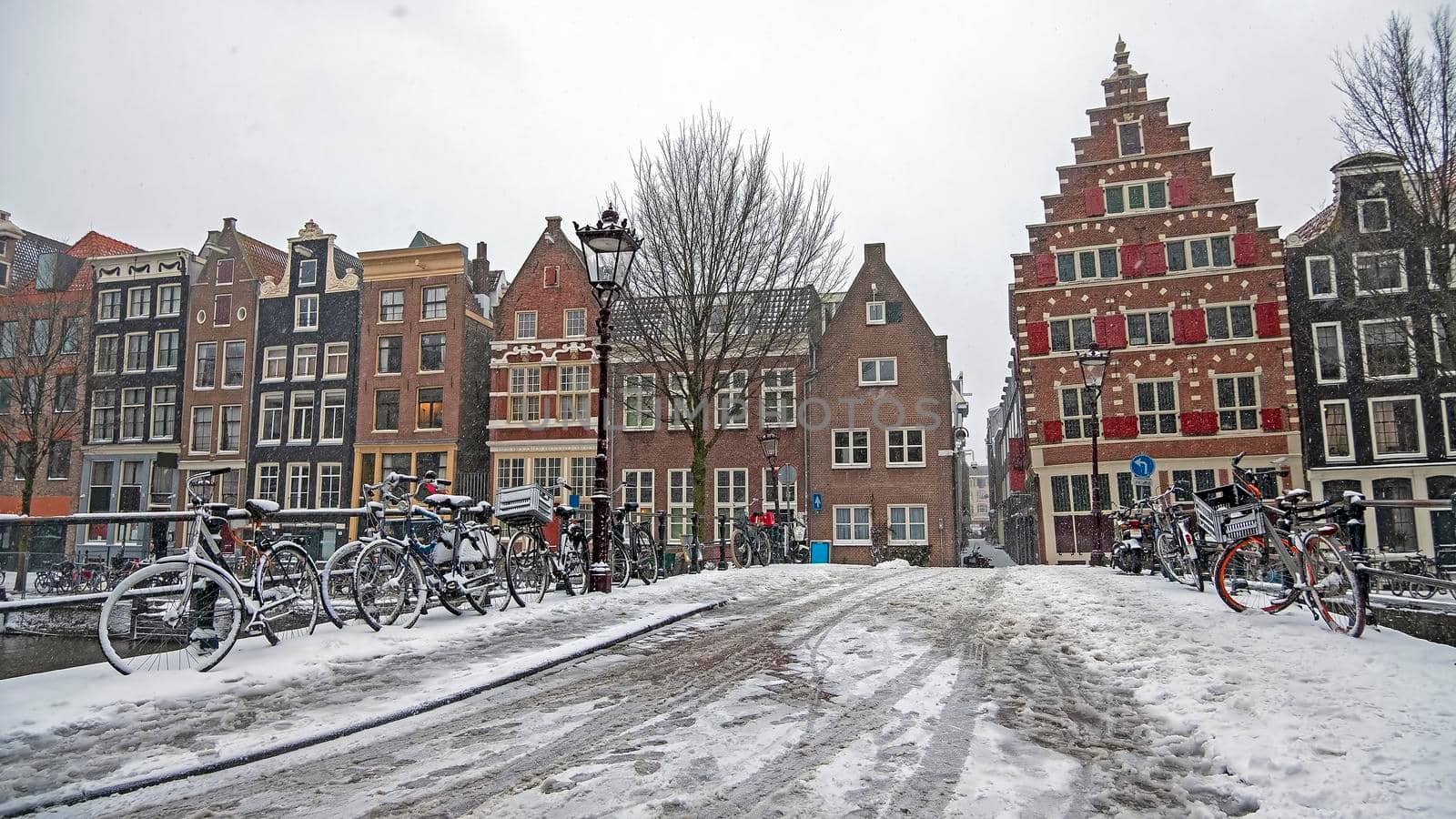 Snowy city Amsterdam in winter in the Netherlands by devy