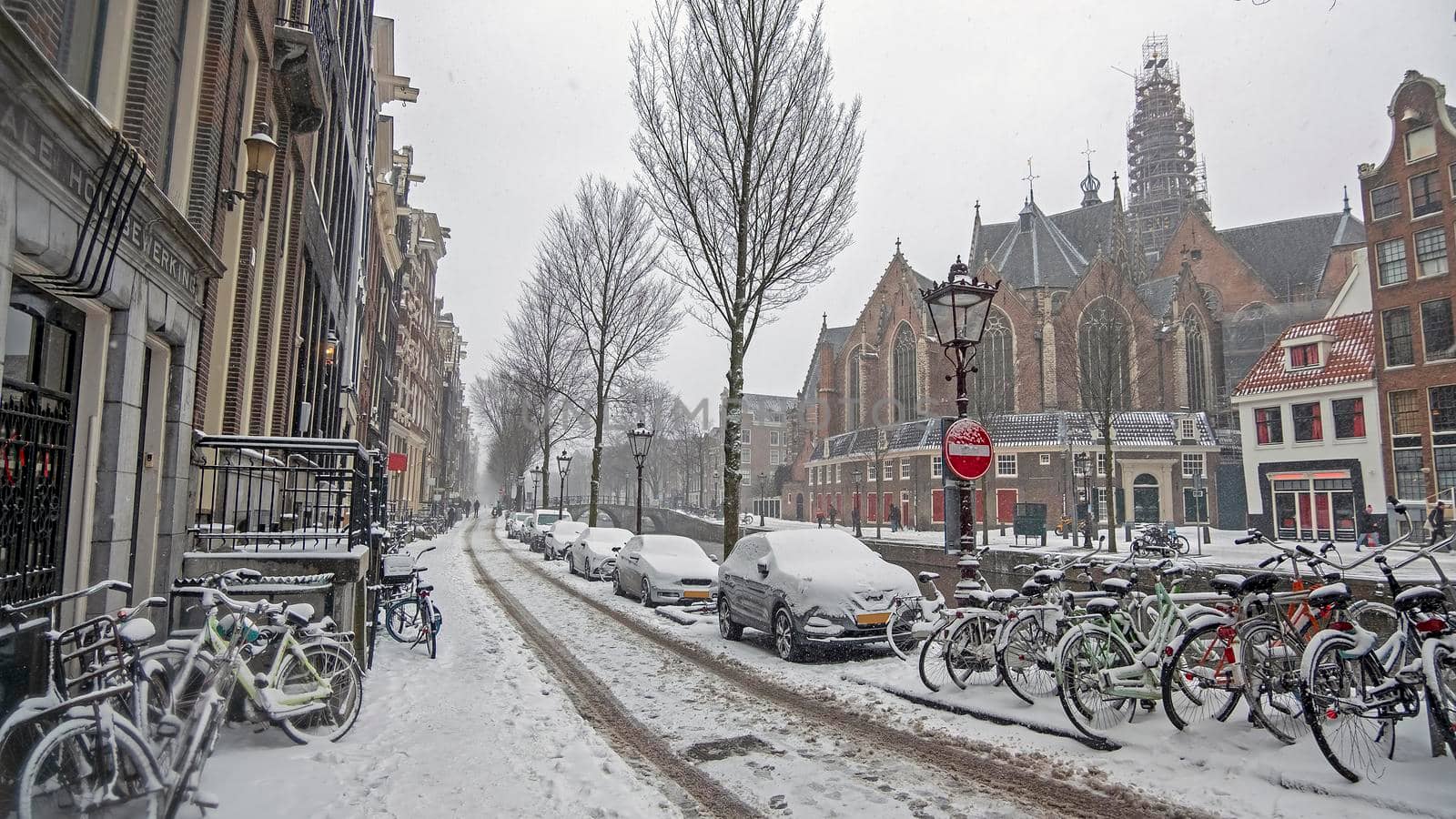 Snowy city Amsterdam in the Netherlands in winter by devy