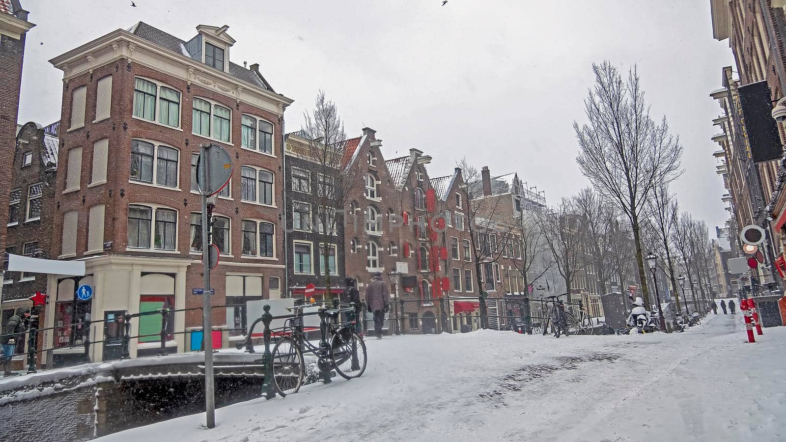 Snowy city Amsterdam in the red light disrict in the Netherlands in winter