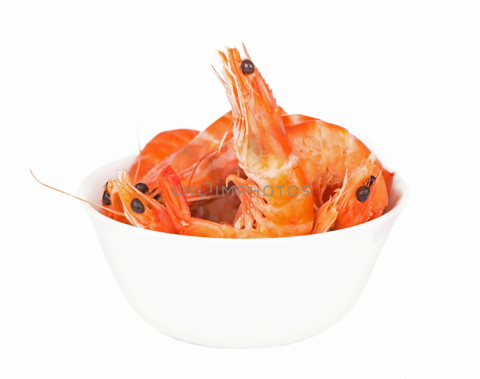 some shrimps in a dish on a white background