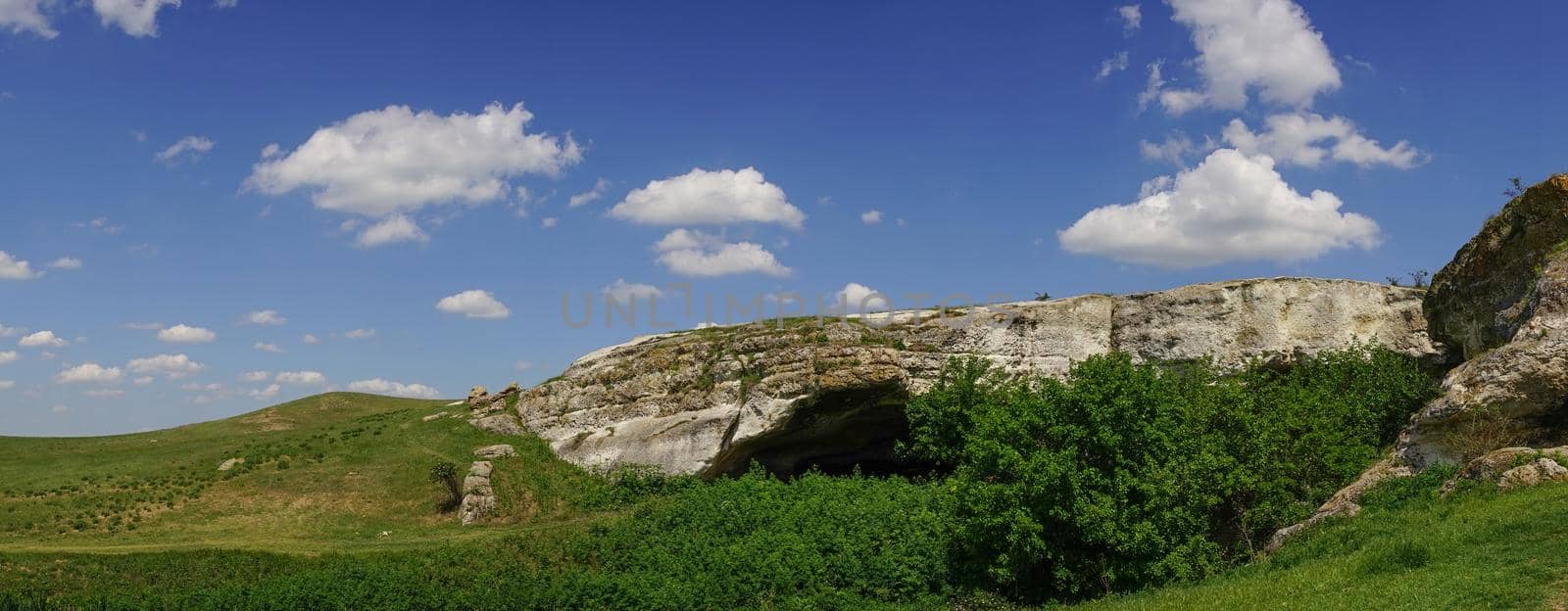 Mountain landscape with views Of the AK-Kaya mountain in the Crimea against the blue .