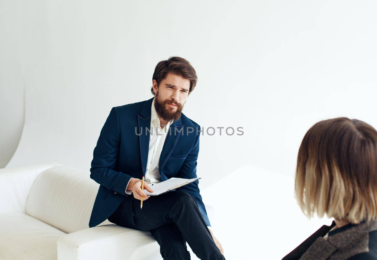 Women and men in suits In the bright room of interviews hiring. High quality photo