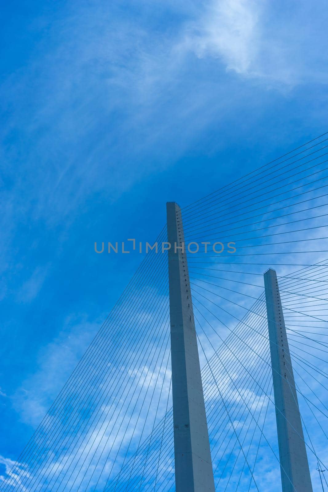 Construction of the Golden bridge against the blue sky. Vladivostok, Russia