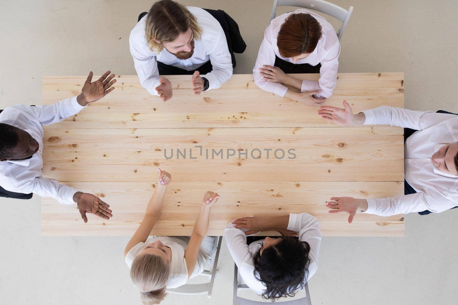 Business people team working at empty meeting table, top view, copy space for text