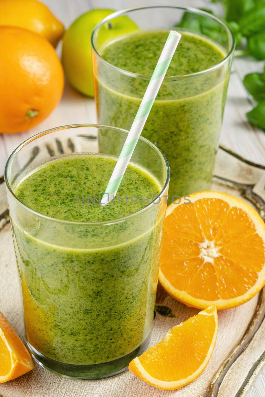 Healthy green smoothie with spinach in glass jars. by Fischeron