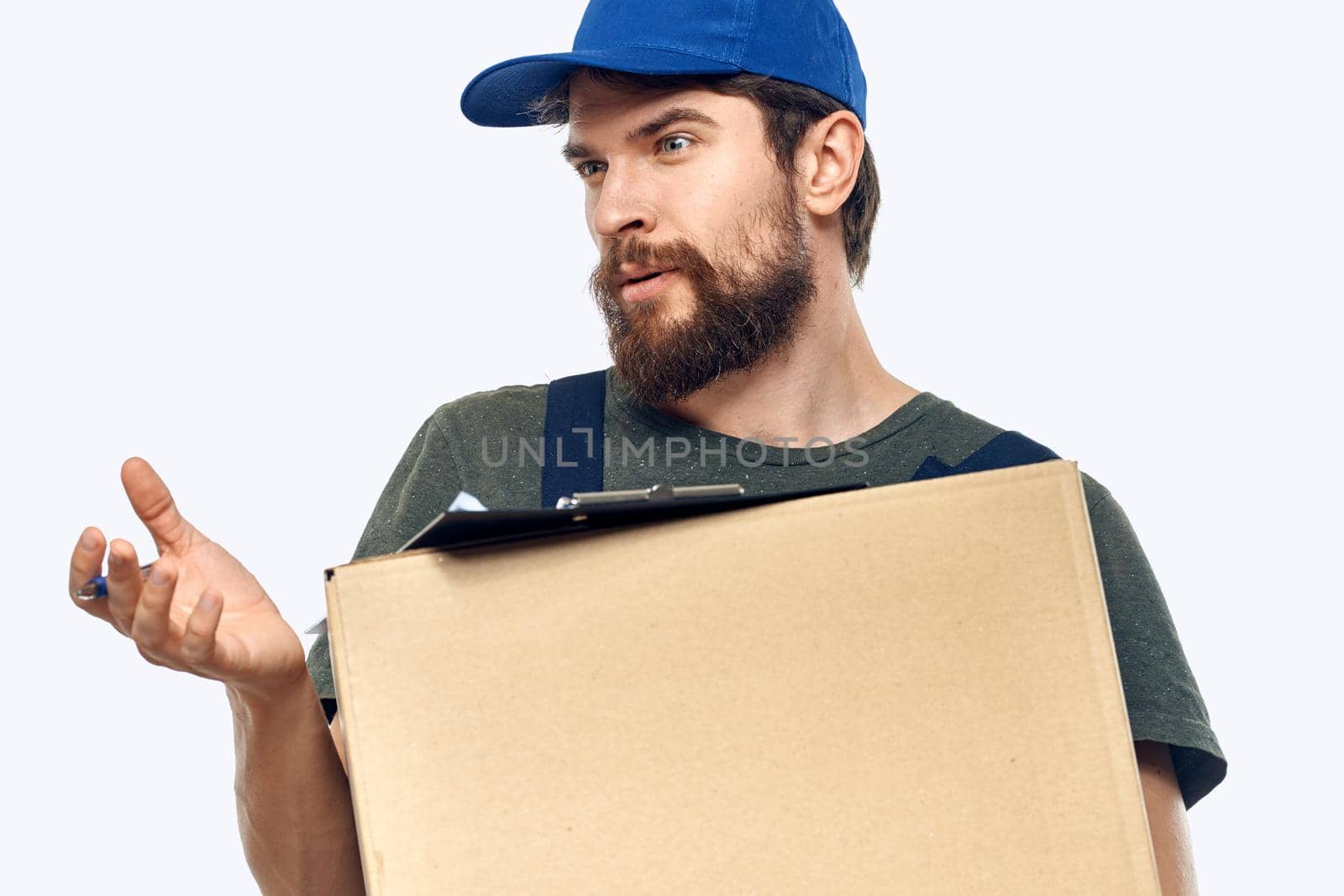 male working uniform box delivery by courier professional. High quality photo