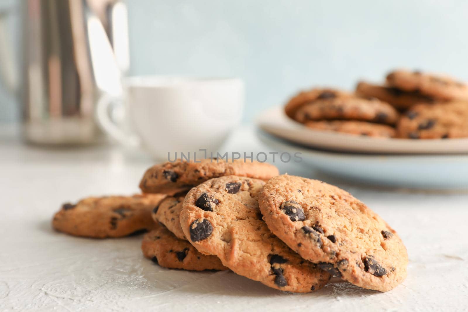 Homemade chocolate chip cookies on gray background, closeup by AtlasCompany