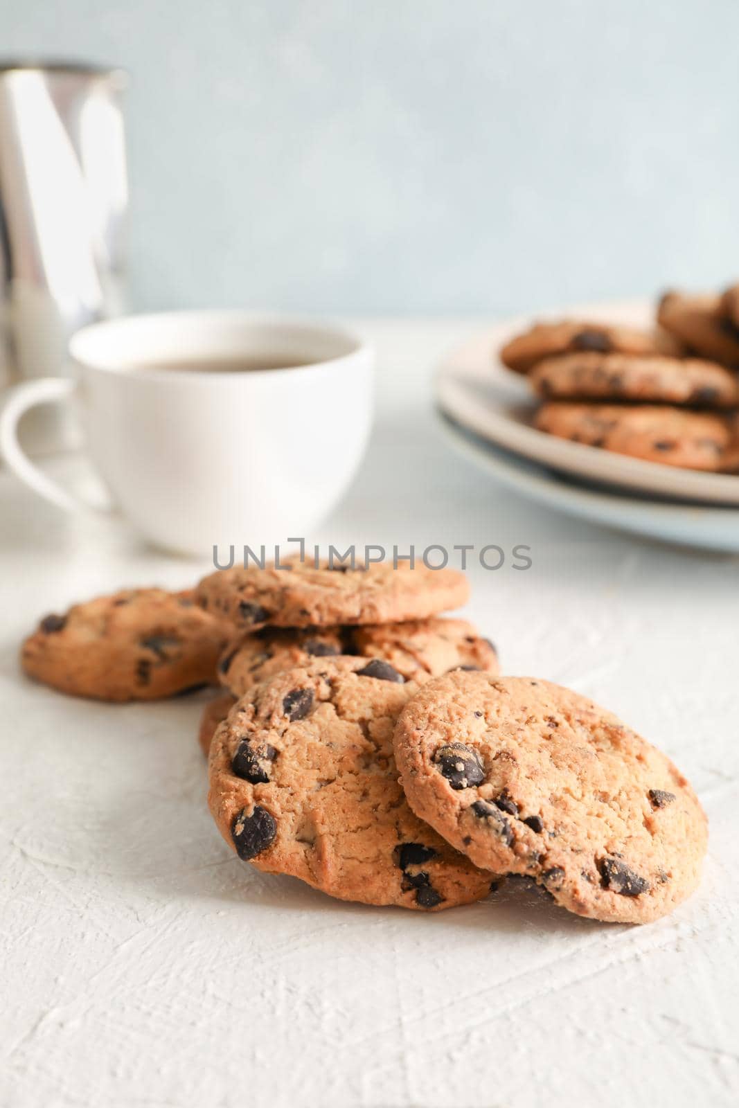 Homemade chocolate chip cookies on gray background, closeup by AtlasCompany