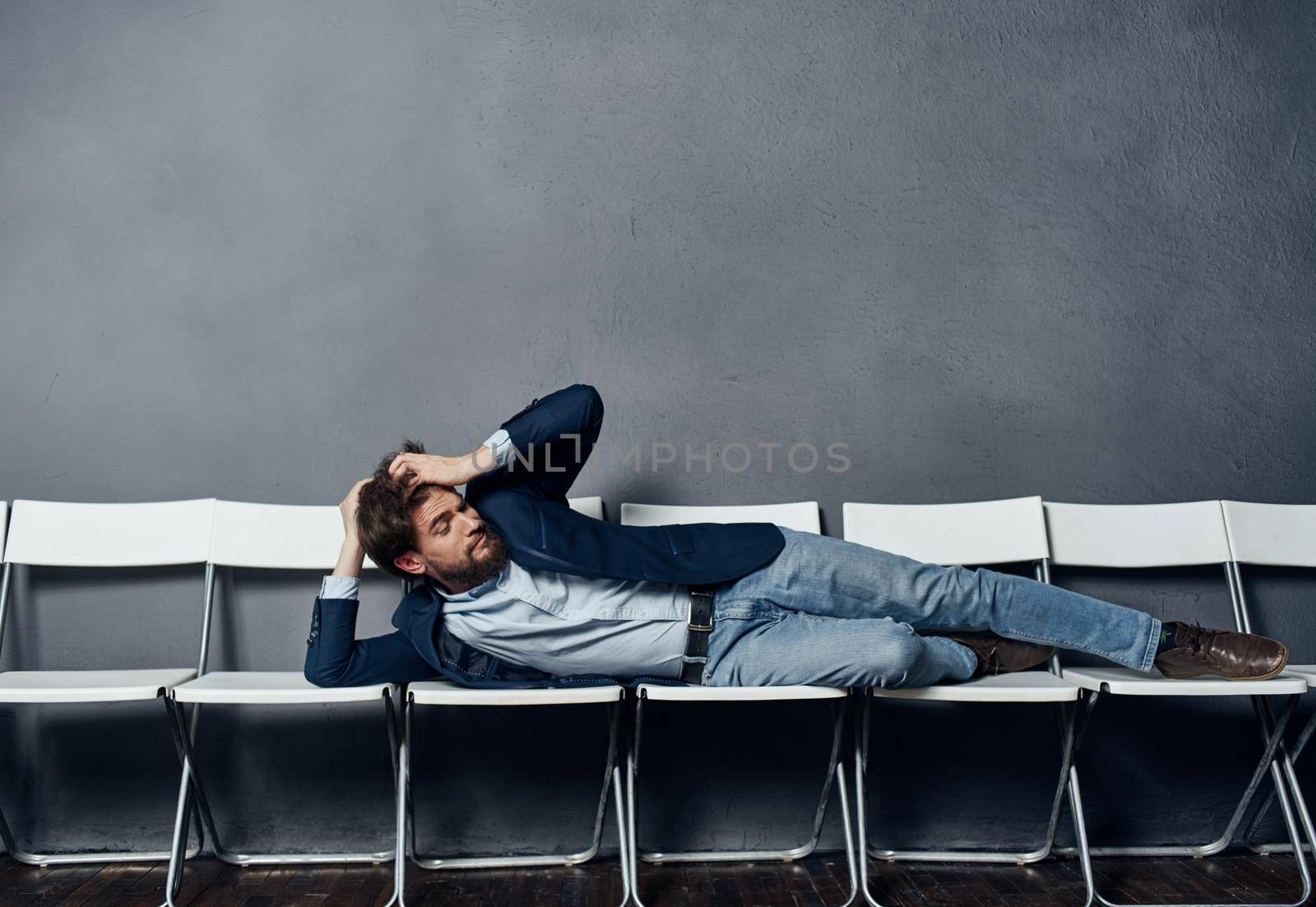 Man in suit on chairs work office career lifestyle. High quality photo