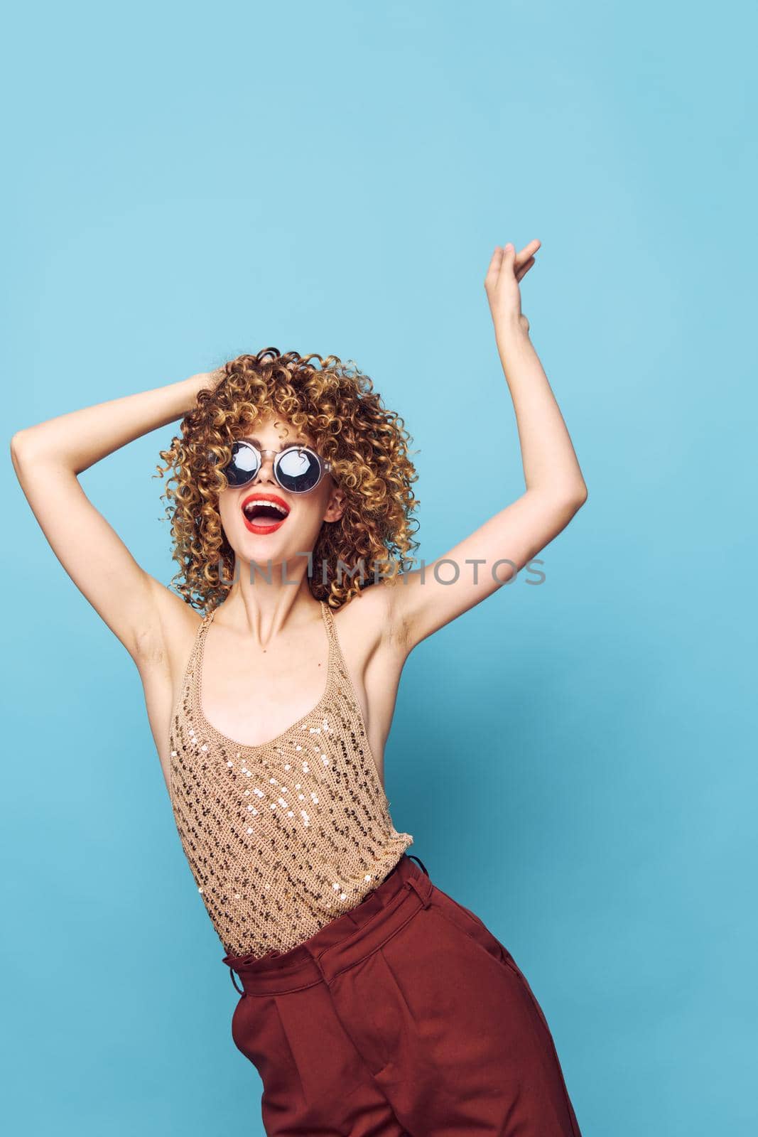 Sexy model curly Red lips emotions gestures with hands Studio hair isolated background