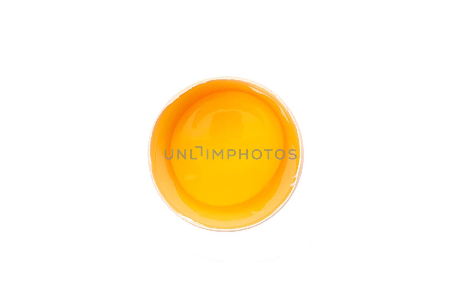 Half broken egg with yolk isolated on white background, top view